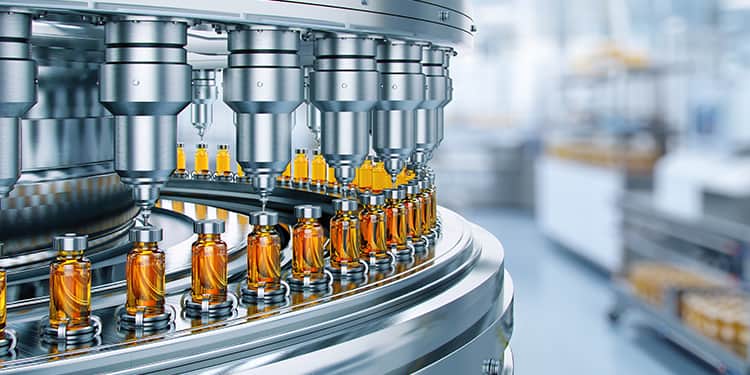 A factory scene featuring a machine with bottles on it.